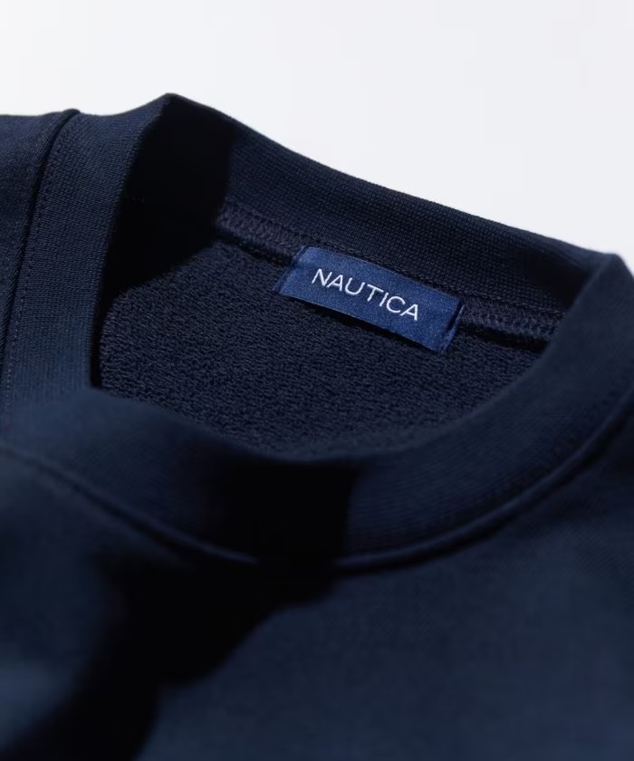 「NAUTICA/ノーティカ」から象徴的なフェルトアーチロゴを配置した”Felt Patch Arch Logo Crewneck Sweatshirt”が発売！